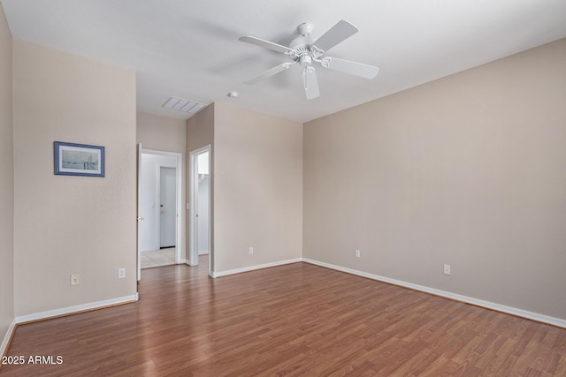 unfurnished room featuring hardwood / wood-style flooring and ceiling fan