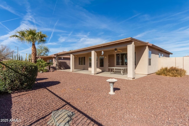 rear view of house with a patio and ceiling fan