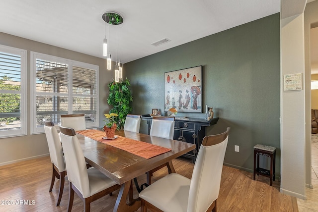 dining room with light hardwood / wood-style floors