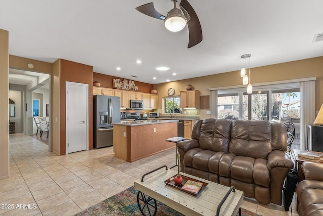 living room with light tile patterned floors and ceiling fan