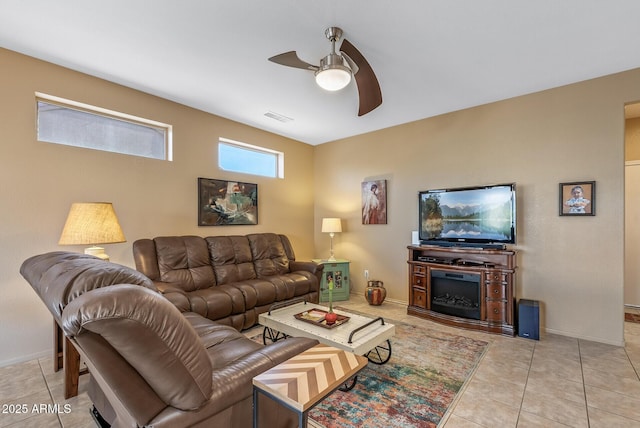 tiled living room featuring ceiling fan