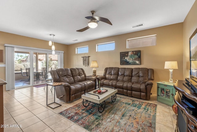 tiled living room featuring ceiling fan