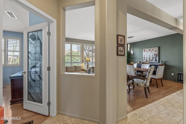 entrance foyer featuring a healthy amount of sunlight and light hardwood / wood-style flooring