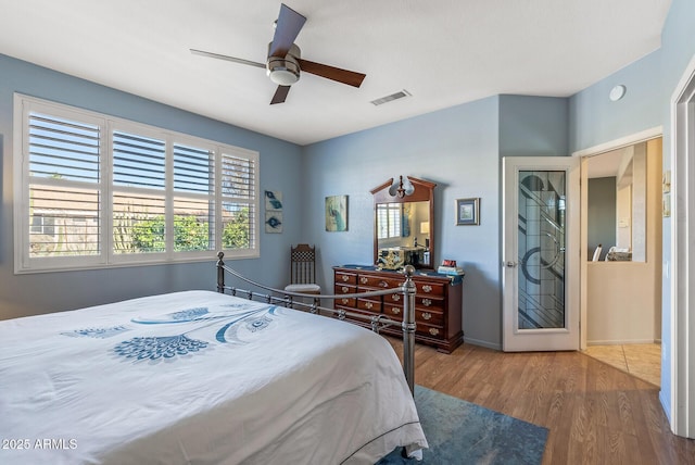 bedroom with hardwood / wood-style flooring and ceiling fan