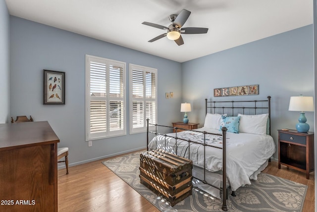 bedroom with ceiling fan and light wood-type flooring