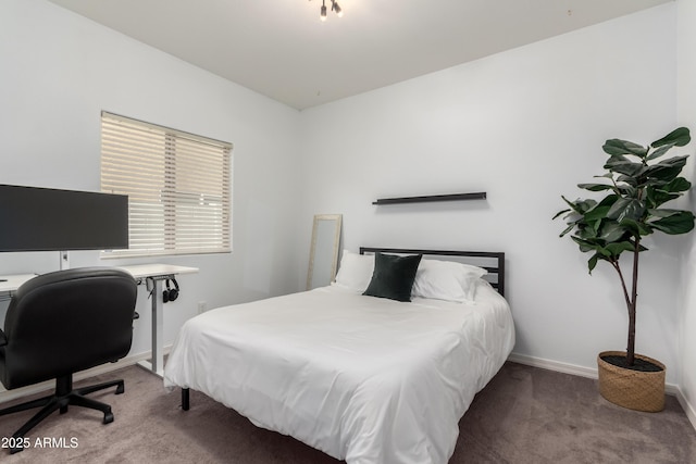 carpeted bedroom with baseboards