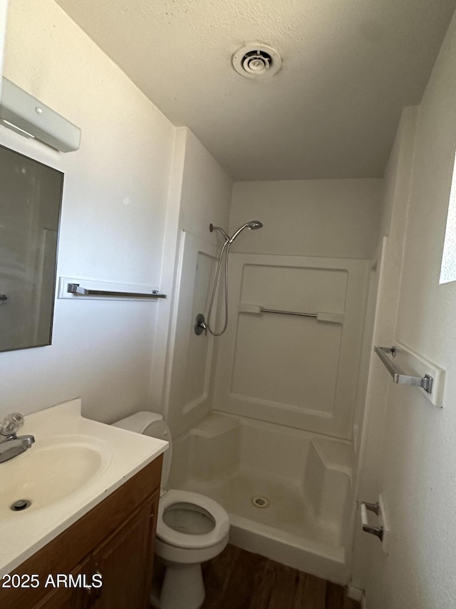 8944 N 17th Ln, Phoenix, AZ 85021 - full bath featuring visible vents, toilet, a shower stall, vanity, and wood finished floors