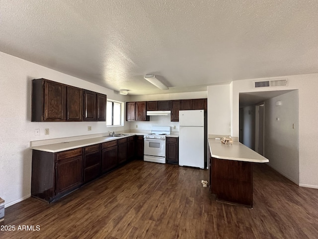 8944 N 17th Ln, Phoenix, AZ 85021 - kitchen featuring light countertops, white appliances, visible vents, and dark brown cabinetry