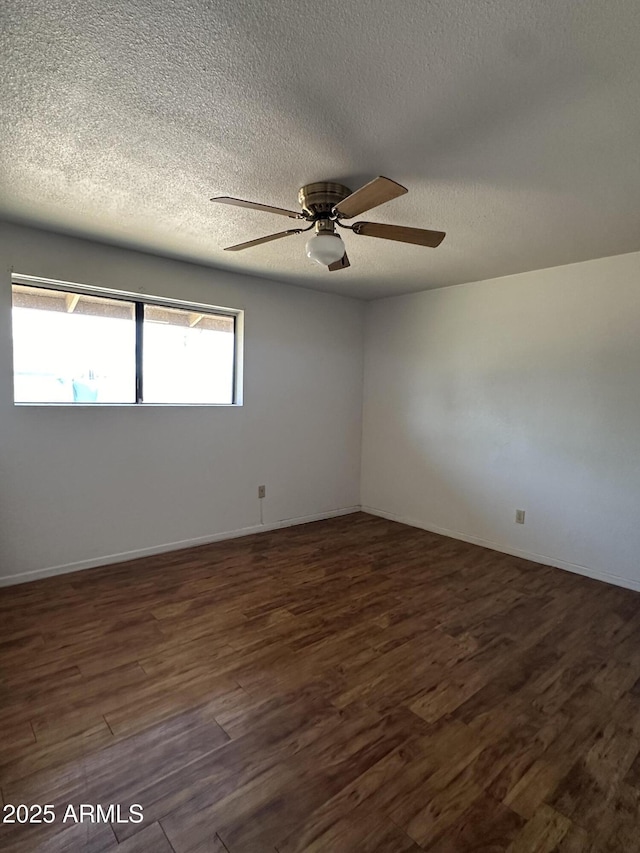 8944 N 17th Ln, Phoenix, AZ 85021 - unfurnished room with baseboards, dark wood-style floors, a textured ceiling, and a ceiling fan