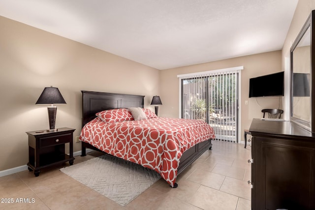 bedroom with light tile patterned floors, access to outside, and baseboards