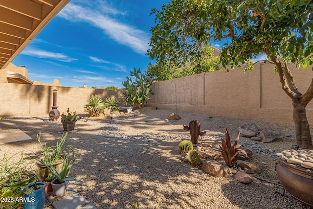 view of yard featuring a fenced backyard