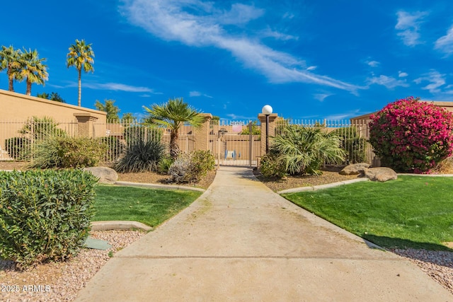 surrounding community featuring a yard, a gate, and fence