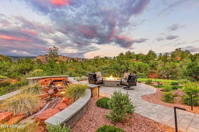 exterior space featuring an outdoor fire pit