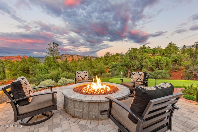 patio terrace at dusk with an outdoor fire pit