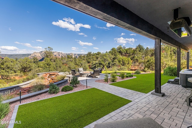 view of yard featuring a mountain view and a patio area