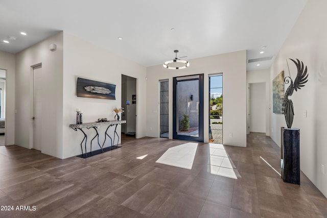 entrance foyer featuring a chandelier