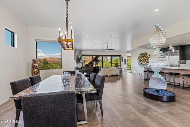 dining space featuring ceiling fan