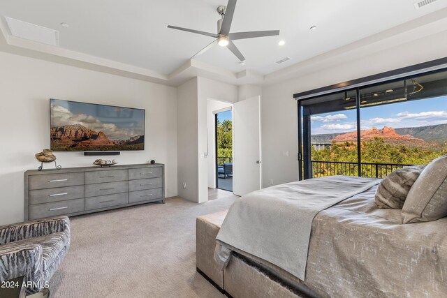 bedroom with access to exterior, ceiling fan, and light carpet