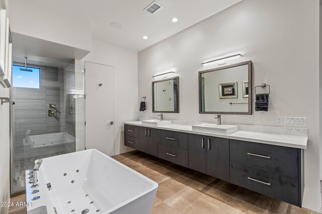 bathroom with vanity, plus walk in shower, and tile patterned floors