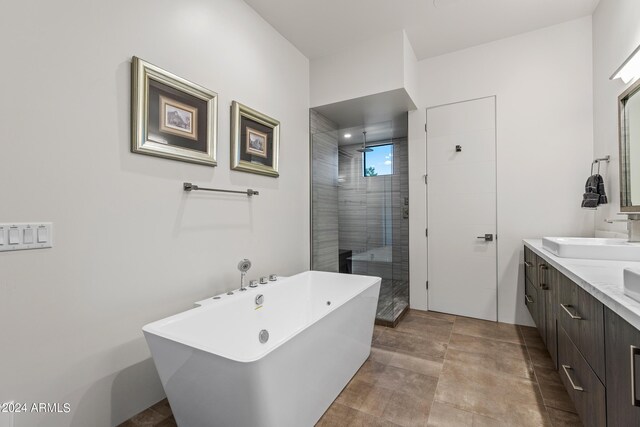 bathroom with vanity and independent shower and bath