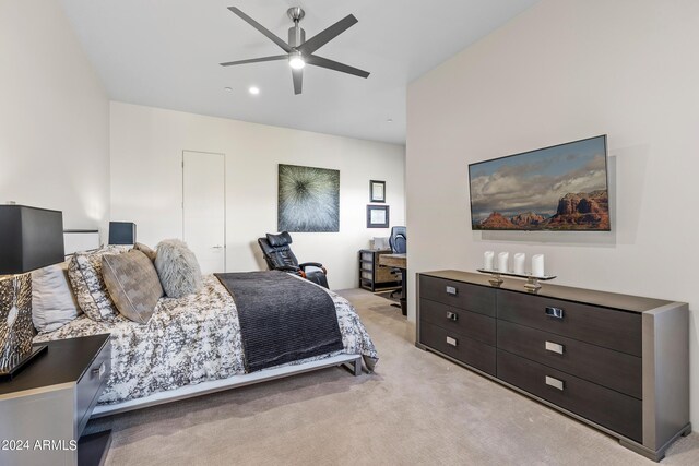 bedroom with ceiling fan and light colored carpet