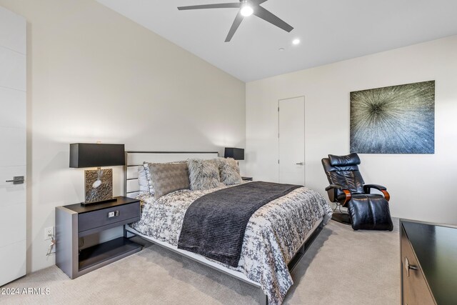 carpeted bedroom with lofted ceiling, ceiling fan, and a closet