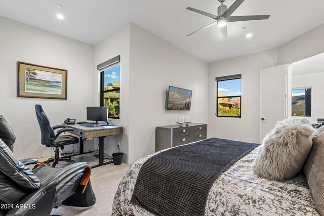 bedroom with light carpet and ceiling fan