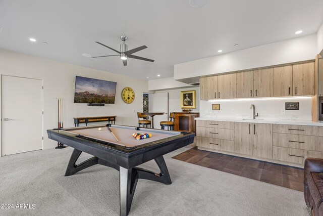 playroom with pool table, ceiling fan, wet bar, and dark colored carpet