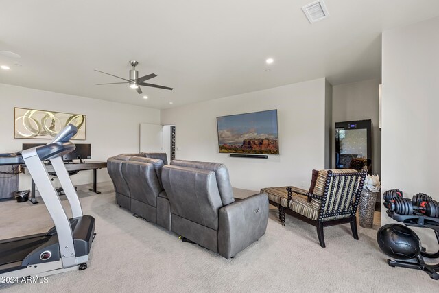 interior space with ceiling fan and light carpet