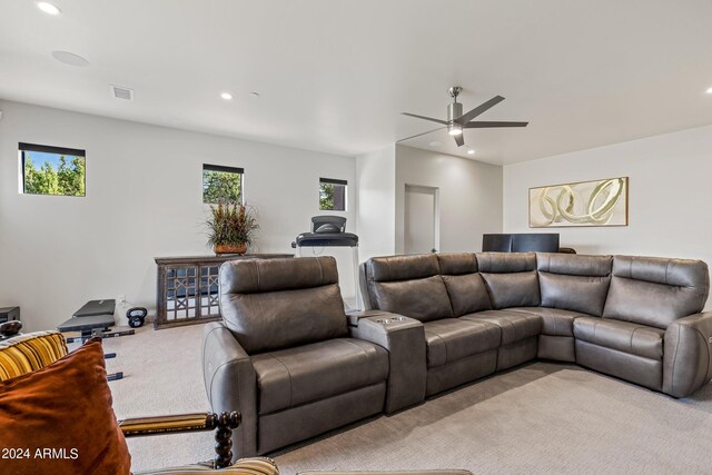 living room featuring light carpet and ceiling fan