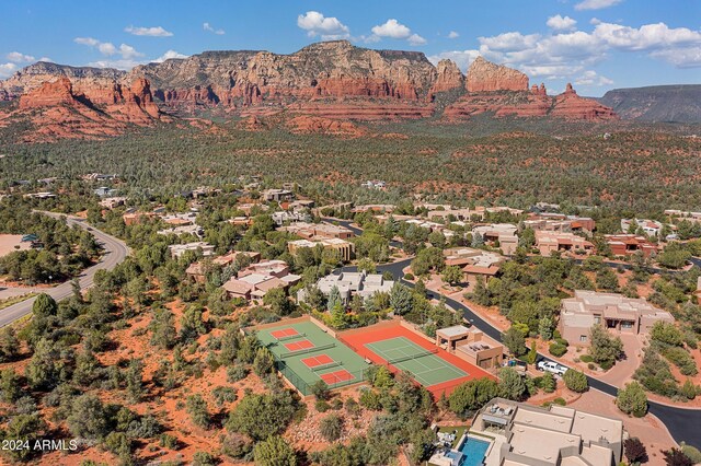 birds eye view of property with a mountain view