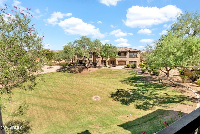 view of yard with a balcony