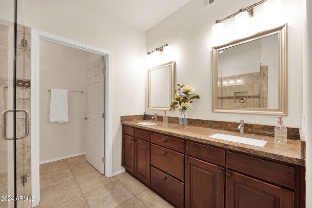 full bathroom featuring a shower stall, visible vents, and a sink