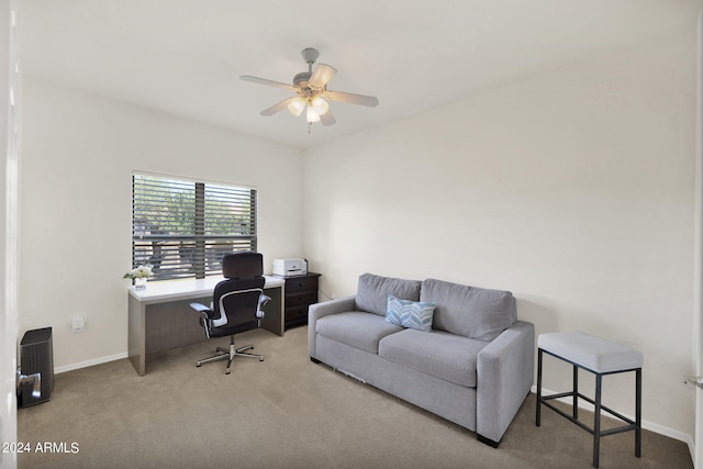 home office featuring carpet flooring, a ceiling fan, and baseboards