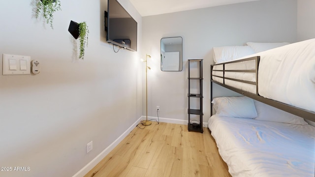 bedroom with light hardwood / wood-style flooring