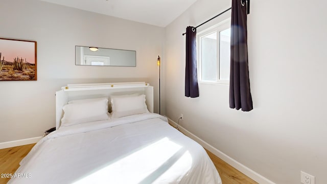 bedroom with light wood-type flooring