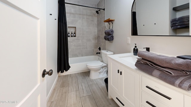 full bathroom with vanity, toilet, and shower / bath combo with shower curtain