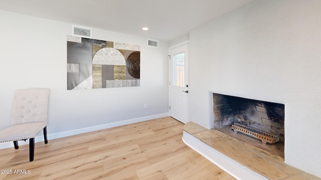 sitting room featuring hardwood / wood-style floors