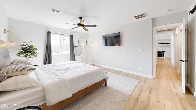 bedroom featuring light hardwood / wood-style flooring and ceiling fan