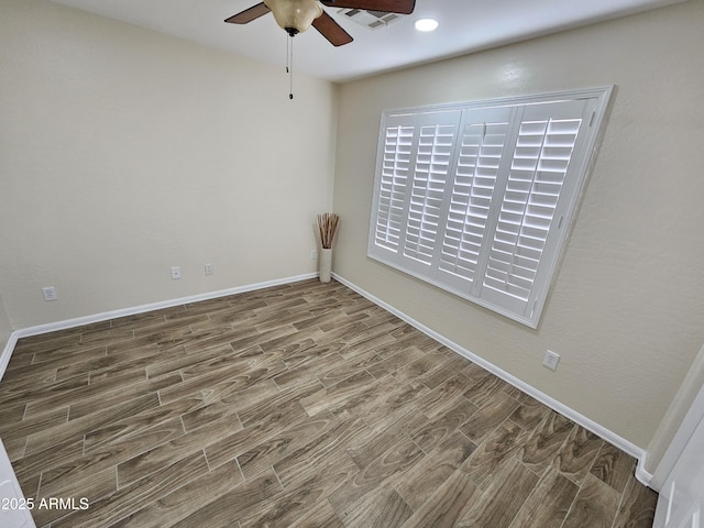 unfurnished room featuring ceiling fan and hardwood / wood-style floors