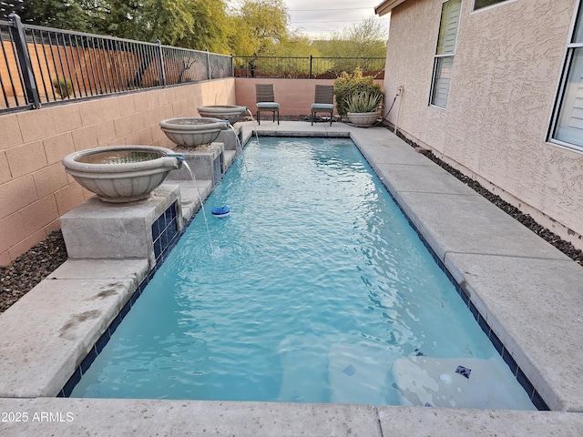 view of pool with pool water feature