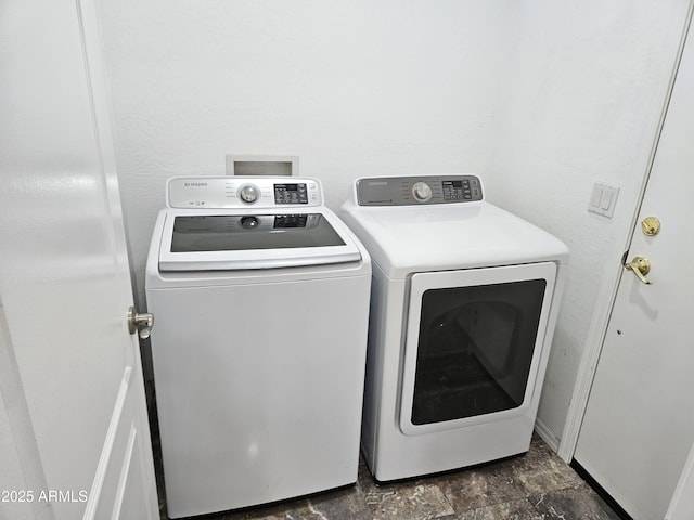 laundry room with separate washer and dryer