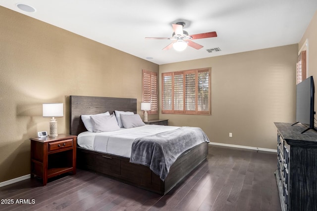 bedroom with a ceiling fan, visible vents, dark wood finished floors, and baseboards