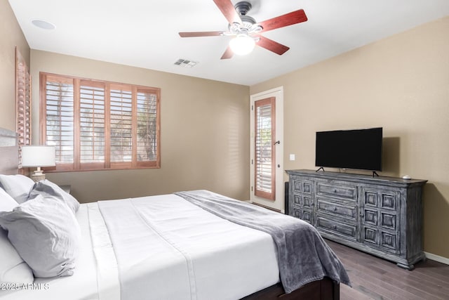 bedroom featuring dark wood-style floors, visible vents, ceiling fan, access to outside, and baseboards