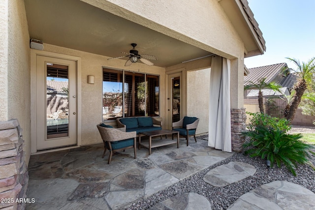 view of patio with a ceiling fan and fence