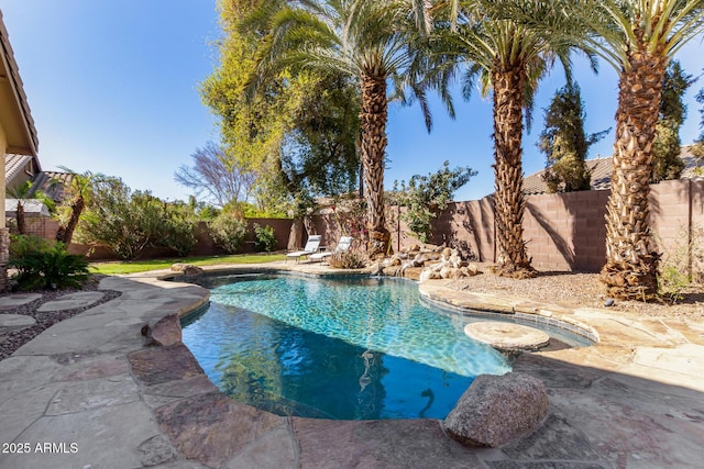 view of swimming pool featuring a fenced backyard, a fenced in pool, and a patio