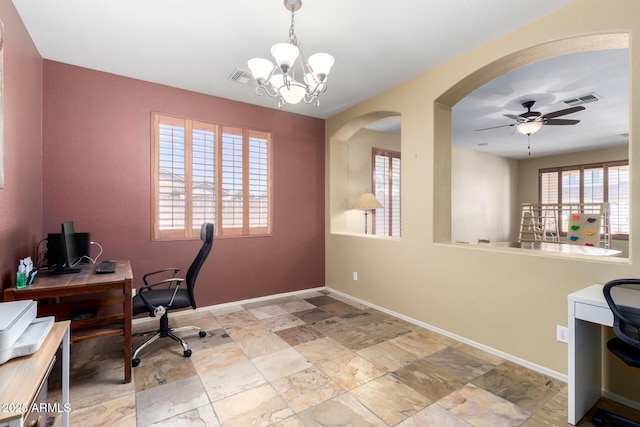 home office with baseboards, visible vents, stone finish flooring, and ceiling fan with notable chandelier