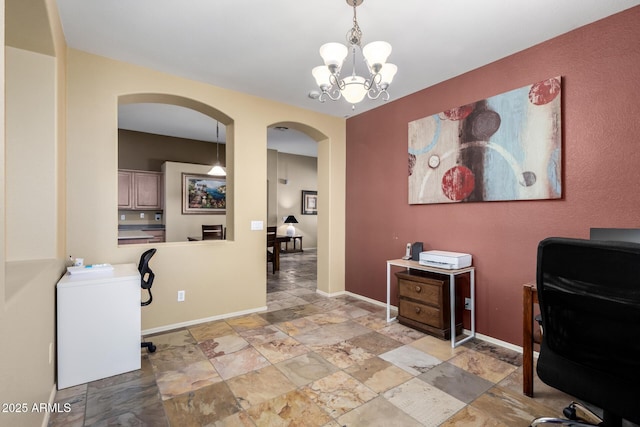 office area featuring arched walkways, baseboards, and an inviting chandelier