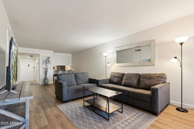 7625 E Camelback Rd Unit B226, Scottsdale, AZ 85251 - living room with wood finished floors and baseboards