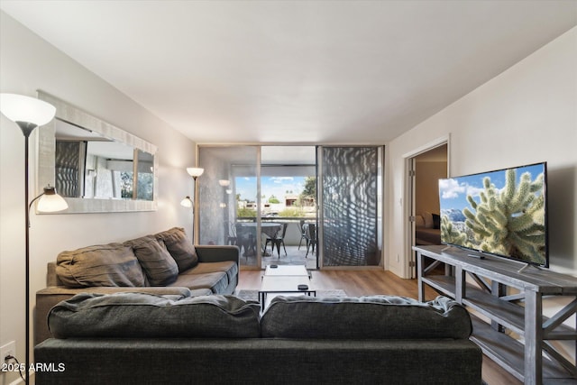 7625 E Camelback Rd Unit B226, Scottsdale, AZ 85251 - living room featuring wood finished floors and a wall of windows